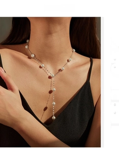 Elegant S925 sterling silver Y-shaped pearl necklace on model with soft lighting