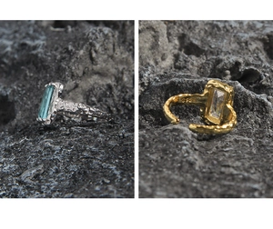 Detail of S925 silver rings with rock texture and rectangular blue and clear gemstones