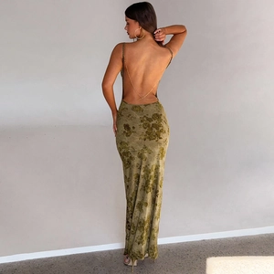 Detail of the backless olive green floral dress featuring elegant crisscross gold chains