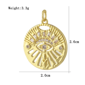 Detailed view of evil eye gold pendant with dimensions 2.6cm by 2.0cm and 3.3g weight