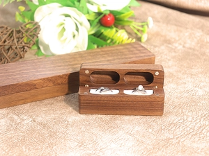 Detail of walnut double ring box with magnetic closure and soft white lining