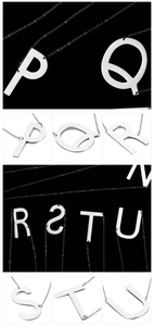 Detailed views of silver metal alphabet pendants showing letters P through U in sleek style