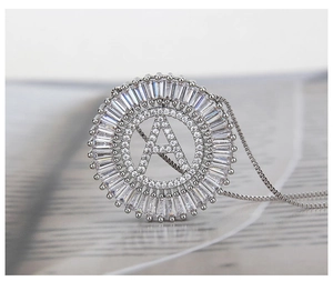Macro shot of silver letter A pendant with shimmering micro-pave cubic zirconia crystals