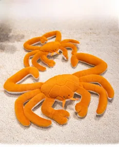Detail of plush orange king crab toy set with soft fur texture on a beige carpet