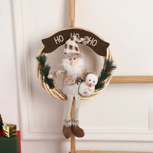 Christmas wreath with Santa gnome, snowman and HO HO HO sign on a rustic wooden door