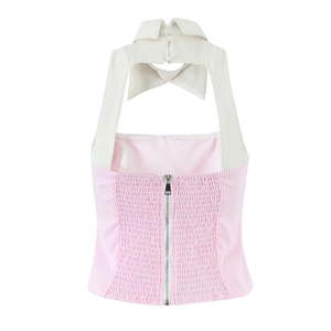 Detail of pink striped halter top featuring a pearl button and elastic ruched back zip