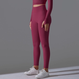 Detail of high waist seamless yoga set with thumbhole cuffs in berry red color