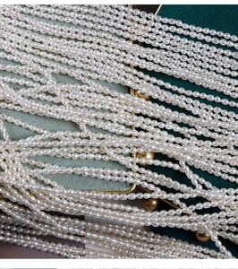 Macro shot of high-luster 2.5mm natural white freshwater rice pearls for DIY jewelry