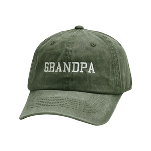 Close-up of white GRANDPA embroidery on washed green vintage cotton baseball cap
