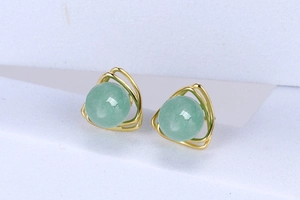 Close-up of S925 silver gold triangular earrings with inlaid green aventurine gemstones
