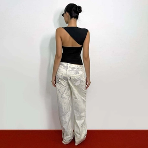 Back view of a black one-shoulder tank top with unique cutout detail and asymmetric fit