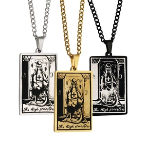 Detailed view of High Priestess tarot card pendants in silver, gold, and black steel