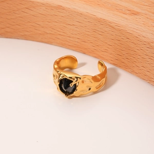 Vintage gold open ring with irregular hammered texture and a black heart gemstone