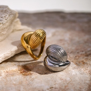 Minimalist 18k gold and silver stainless steel teardrop rings with striped texture
