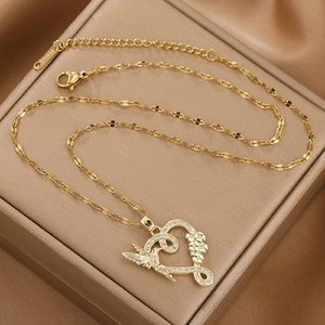 Elegant 18K gold-plated heart necklace with bird and flower pendant on jewelry box