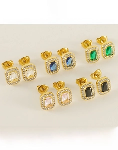 Detailed macro of titanium steel earrings with large square zircons in multiple colors