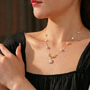 French vintage antler necklace with white pearls and sparkling cubic zirconia on a gold chain