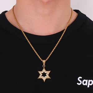 Detail of 18K gold plated hexagram star pendant with rhinestones on a twist chain neck