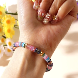 Colorful semi-precious bead bracelet with abacus-style stones on a female wrist