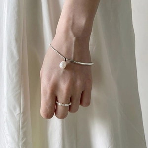 Minimalist S925 sterling silver pearl bracelet and ring set for women on white background