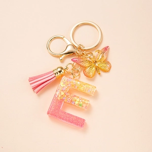 Letter E resin keychain with pink tassel and glitter butterfly charm for bags and car keys