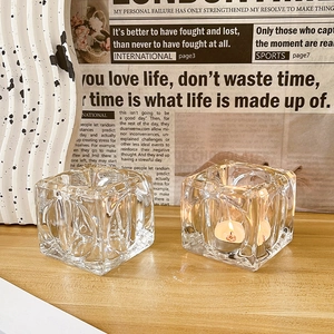 Nordic light luxury glass ice cube candle holders set on a wooden table for home decor