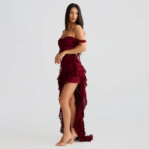 Detail of dark red lace dress featuring an off-shoulder neckline and asymmetric hemline