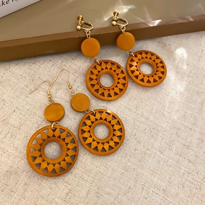 Retro hollow wooden style geometric sun earrings in orange-brown for pierced and non-pierced ears