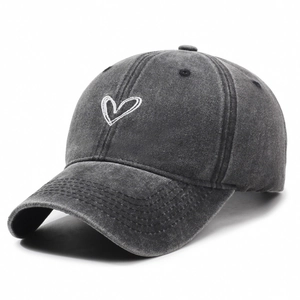 Washed dark grey baseball cap with white embroidered heart on minimalist cotton fabric