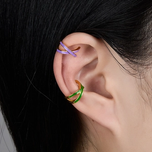 Detail of S925 sterling silver ear cuffs with purple and green enamel in double-layer design