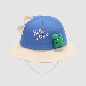Detail of the cute 3D green dinosaur doll and Hello Dino embroidery on toddler sun hat