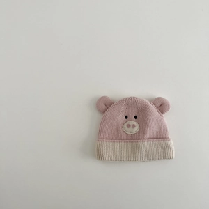 Detail of pink and beige knitted baby hat featuring cute animal embroidery and 3D ears