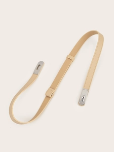 Close-up of beige leather belt featuring silver metal twist lock and Saffiano texture