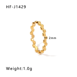 Detail view of 2mm gold plated gear textured ring showing width and 1.0g weight specs