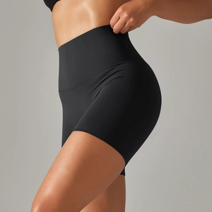 Side view of black high-waisted yoga shorts with seamless fit and sculpting peach lift