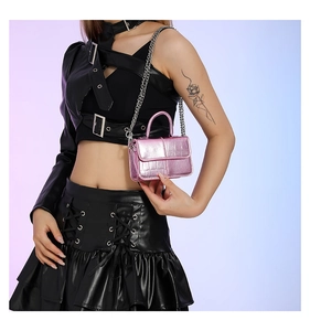 Pink glossy crocodile pattern mini crossbody bag with silver chain strap and handle