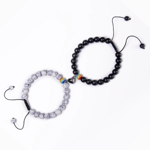 Detail of magnetic heart clasp connecting natural stone beaded bracelets for couples