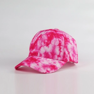 Close-up of the vibrant pink and white tie-dye pattern on the six-panel baseball cap