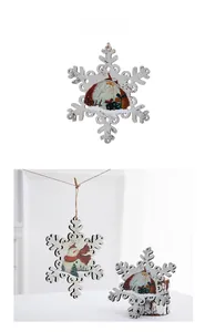Detail of wooden snowflake Christmas ornament with vintage painted Santa illustration