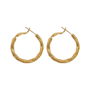 Golden irregular textured hoop earrings with hammered finish in a minimalist metal style