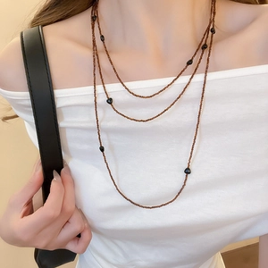 Three-layer vintage beaded necklace with brown small beads and black heart elements