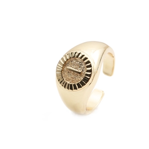 Detail view of a gold-plated open ring featuring a vintage matte textured circular face