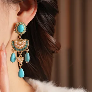 Vintage silver needle drop earrings with turquoise and pearls in a bohemian palace style