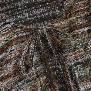 Close-up of multicolor long-hair knit fabric with tie-up bow detail on fashionable set