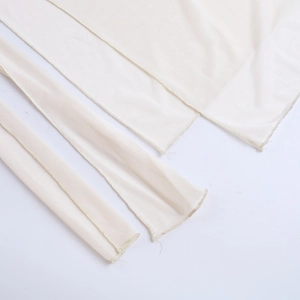 Detail of beige mesh fabric showing high-quality stitching and semi-transparent texture