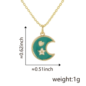 Detail view of 18K gold plated moon and star pendant with green enamel and measurements