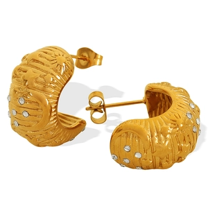 Gold-plated C-shaped hoop earrings with embossed star moon patterns and zircon stones