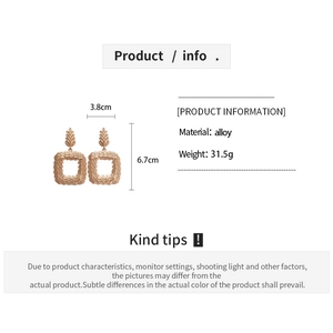 Detailed view of square braided gold earrings with 3.8cm width and 6.7cm height