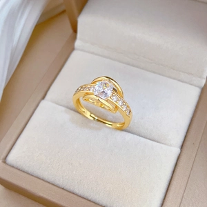 Detail view of adjustable gold-plated ring with white marquise zircon in luxury box