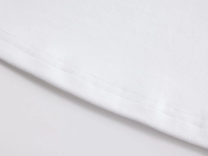 Close-up of double-needle stitching and fine cotton texture on white slim-fit U-neck tee